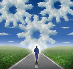 corporate goals and horizon with a businessman walking as a leader towards a glowing sky with a group of clouds shaped as gear wheels and cogs as a symbol of business success and career planning strategy