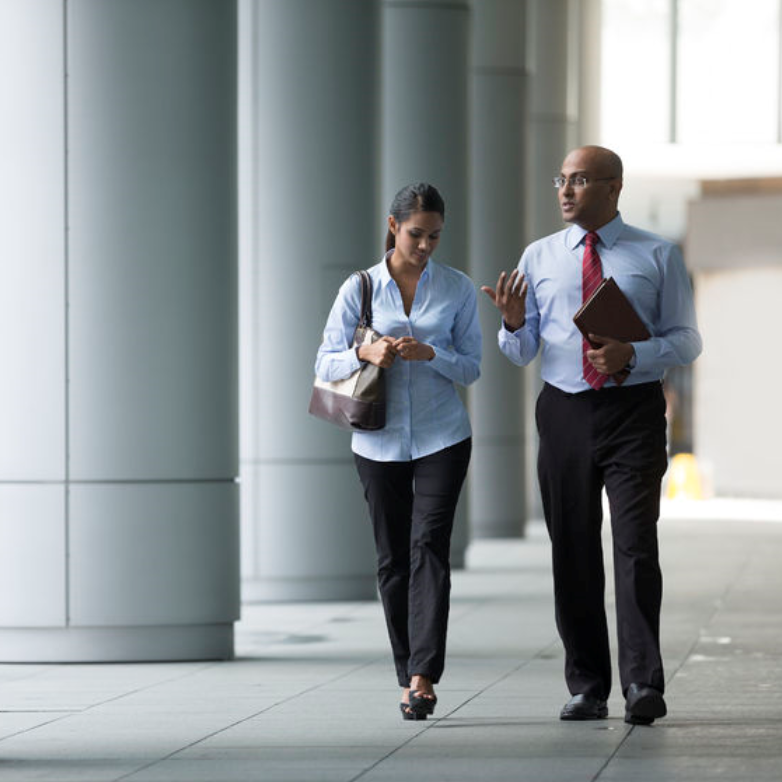 man walking with woman in a corridor